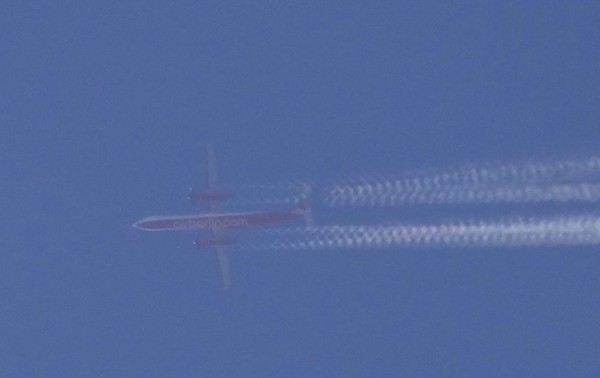 This Dash 8 was in a cloud and its props made these interesting corkscrew contrails. I toyed with brightness and contrast to make the plane visible, as its was merely grey in grey.