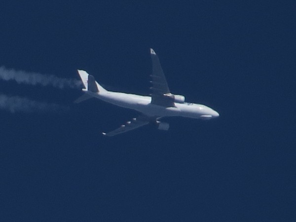 MASkargo A330 9M-MUB. Interesting bulge at the nose. Picture suffering from heat in the air.