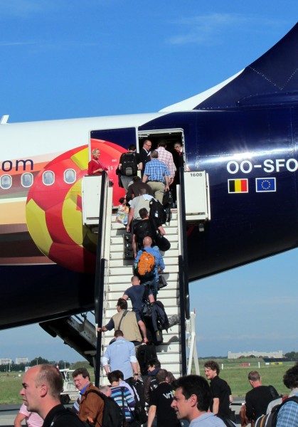 The journalists climb on board through the back door