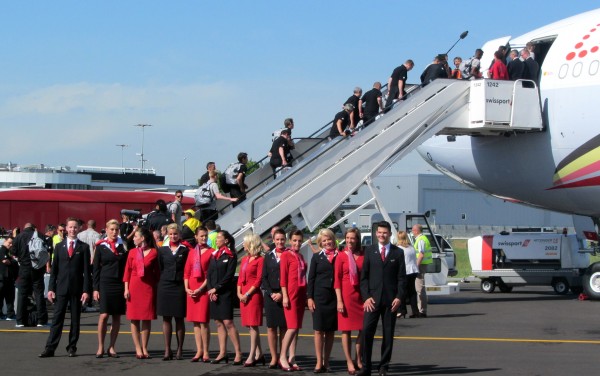 Embarkation of the team through the front door to the business class section